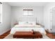 Bright main bedroom with neutral decor, a large bed and wood floors at 2931 W 20Th Ave, Denver, CO 80211