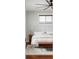 Inviting main bedroom with a large bed, neutral decor, hardwood floors, and a ceiling fan at 2931 W 20Th Ave, Denver, CO 80211