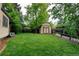 Lush green backyard featuring a well-maintained lawn, an outdoor storage shed, and a fenced boundary at 800 Mesa Ct, Broomfield, CO 80020