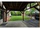 Landscaped backyard features a covered patio, wooden deck, green lawn and an outdoor storage shed at 800 Mesa Ct, Broomfield, CO 80020