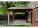 Charming backyard featuring a wooden pergola with string lights, blending indoor-outdoor living seamlessly at 800 Mesa Ct, Broomfield, CO 80020