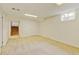 Spacious basement featuring neutral carpet, a window, and access to stairs, offering ample space for activities at 800 Mesa Ct, Broomfield, CO 80020