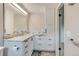 The bathroom features a new vanity with granite countertops, large mirror, modern lighting, and tile flooring at 800 Mesa Ct, Broomfield, CO 80020