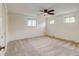 Large bedroom with ample natural light provided by three windows and a ceiling fan at 800 Mesa Ct, Broomfield, CO 80020
