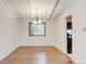 Bright dining area with hardwood floors and a view into the kitchen area at 800 Mesa Ct, Broomfield, CO 80020