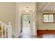 Welcoming foyer featuring a coat closet and view of the living area and front porch at 800 Mesa Ct, Broomfield, CO 80020