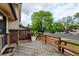 Inviting wooden front porch with a built-in bench and neighborhood views at 800 Mesa Ct, Broomfield, CO 80020