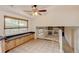 Bright kitchen with tile floors, stainless appliances, light wood cabinets, a skylight, and eat-in dining space at 800 Mesa Ct, Broomfield, CO 80020