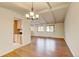 Open-concept living room with vaulted ceilings, wood floors, neutral paint, and lots of natural light at 800 Mesa Ct, Broomfield, CO 80020