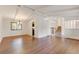 Open concept living room featuring hardwood flooring and access to other rooms at 800 Mesa Ct, Broomfield, CO 80020