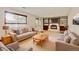 Cozy living room with built in bookcases and a fireplace, furnished with comfortable sofas at 800 Mesa Ct, Broomfield, CO 80020