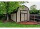 Backyard storage shed with neutral siding and dark trim at 800 Mesa Ct, Broomfield, CO 80020
