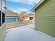 View of backyard with snow and a partially visible fence at 9437 E 108Th Dr, Commerce City, CO 80640