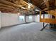 Unfinished basement with exposed beams and carpet at 9437 E 108Th Dr, Commerce City, CO 80640