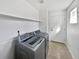 Laundry room with washer, dryer, and access to outside at 9437 E 108Th Dr, Commerce City, CO 80640