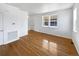 Living room with hardwood floors and two windows at 9437 E 108Th Dr, Commerce City, CO 80640