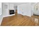 Living room with hardwood floors, fireplace, and high ceilings at 9437 E 108Th Dr, Commerce City, CO 80640