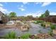 Backyard with multiple raised garden beds, perimeter fence, and mature trees at 491 Campo St, Denver, CO 80221