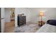 Cozy bedroom with light-colored floors, chest of drawers and a bed at 491 Campo St, Denver, CO 80221