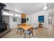 Bright living room with a wood-burning stove, modern decor, and light hardwood floors at 491 Campo St, Denver, CO 80221