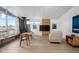 Living room features natural lighting, wood floors, wood burning fireplace and modern furniture at 491 Campo St, Denver, CO 80221