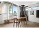 Cozy Living Room and dining area with natural light and a wood burning fireplace at 491 Campo St, Denver, CO 80221