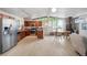 Spacious kitchen with stainless appliances open to the living room with modern lighting at 491 Campo St, Denver, CO 80221