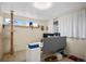Bright home office featuring a large window, light colored walls, and modern hardwood floors at 491 Campo St, Denver, CO 80221