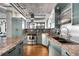 Modern kitchen with granite countertops and stainless steel appliances at 1401 Wewatta St # 1006, Denver, CO 80202