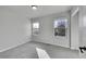 Simple and practical bedroom with carpeting, and natural light from two windows at 2518 S Ouray Way, Aurora, CO 80013