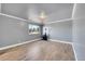 This bedroom features hard wood floors, neutral paint, and a large window at 2518 S Ouray Way, Aurora, CO 80013