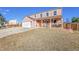 Charming two-story home with a covered porch and two car garage on a sunny day at 2518 S Ouray Way, Aurora, CO 80013