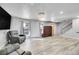 Spacious living room with hardwood floors, natural light, and staircase access at 2518 S Ouray Way, Aurora, CO 80013