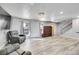 Bright living room featuring hardwood floors, a modern chandelier, and a staircase at 2518 S Ouray Way, Aurora, CO 80013