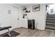 Finished basement with bar area, sink, wine cooler, and stairs at 1308 S Sherman St, Denver, CO 80210