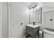 Compact bathroom featuring a gray vanity, a framed mirror and shower at 1308 S Sherman St, Denver, CO 80210