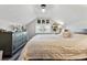 Comfortable bedroom with a queen bed, dresser, and decoratively adorned walls at 1308 S Sherman St, Denver, CO 80210