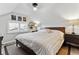 Comfortable bedroom with a queen bed, dresser, and decoratively adorned walls at 1308 S Sherman St, Denver, CO 80210