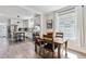 Bright dining area adjacent to kitchen, featuring a wooden table and natural light at 1308 S Sherman St, Denver, CO 80210