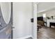 Inviting entryway featuring a view into the living room with a fireplace at 1308 S Sherman St, Denver, CO 80210