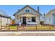 Charming single-story home with a well-maintained lawn and inviting front porch at 1308 S Sherman St, Denver, CO 80210