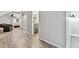 Hallway featuring vinyl flooring, an adjoining bedroom, and a bathroom with a grey vanity at 1308 S Sherman St, Denver, CO 80210