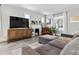 Bright living room with hardwood floors, a modern entertainment center and a comfortable sofa at 1308 S Sherman St, Denver, CO 80210