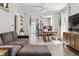 Open-concept living room and dining area offering a bright and spacious feel at 1308 S Sherman St, Denver, CO 80210
