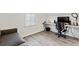 Bright home office with a large monitor, desk, comfortable chair, and a sofa, and natural light at 1308 S Sherman St, Denver, CO 80210