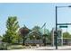 Public art installation at a street intersection with trees and city buildings in the background at 1308 S Sherman St, Denver, CO 80210