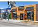 Restaurant exterior showcasing a colorful mural, awnings, and outdoor seating area, street-side at 1308 S Sherman St, Denver, CO 80210