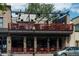 Restaurant featuring a second-story patio with open-air seating and a street-level entrance at 1308 S Sherman St, Denver, CO 80210
