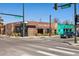 Street corner featuring Maria Empanada restaurant with outdoor seating and colorful architecture at 1308 S Sherman St, Denver, CO 80210
