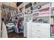 A walk-in closet featuring lots of shelves, drawers, and clothes racks at 3100 Huron St # 2D, Denver, CO 80202